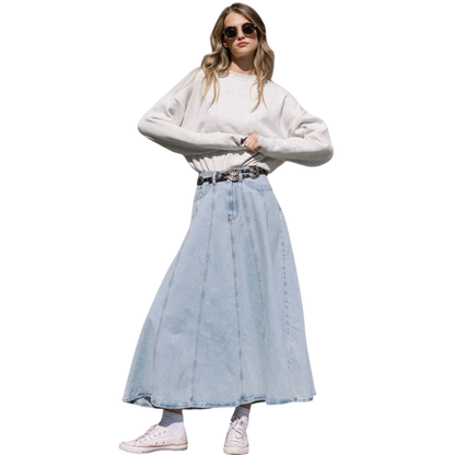 A person with curly hair models the Cozy Earth Women's CityScape Crewneck and matching pants in light pink against a plain white backdrop. |Color:Peony