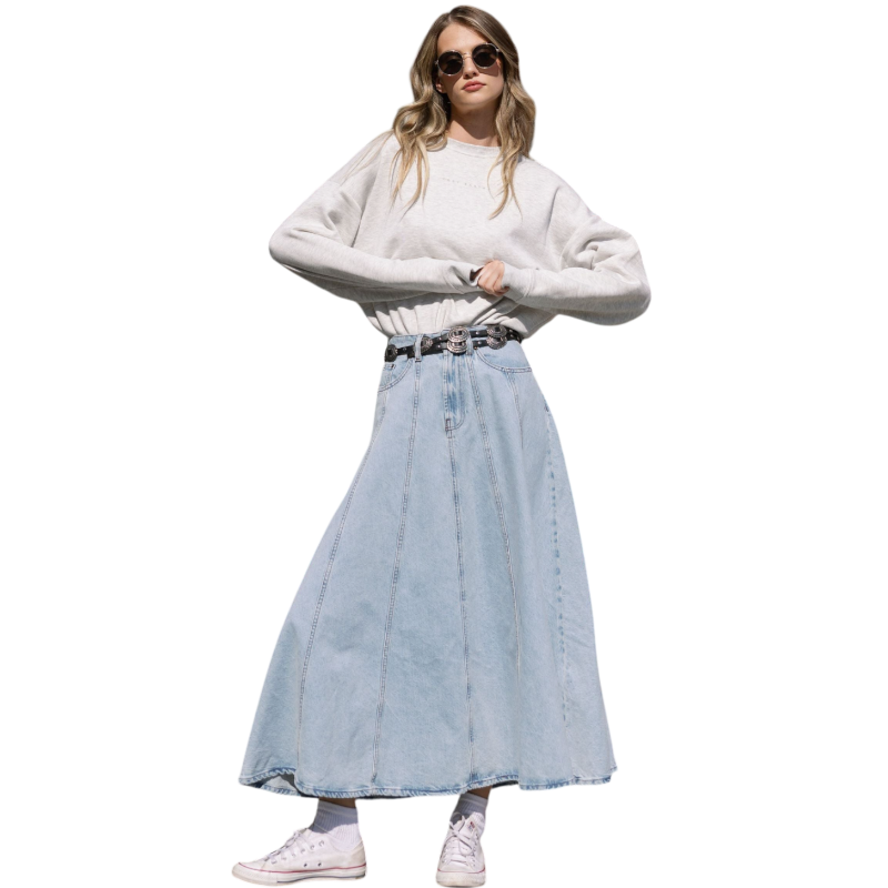 A person with curly hair models the Cozy Earth Women's CityScape Crewneck and matching pants in light pink against a plain white backdrop. |Color:Peony
