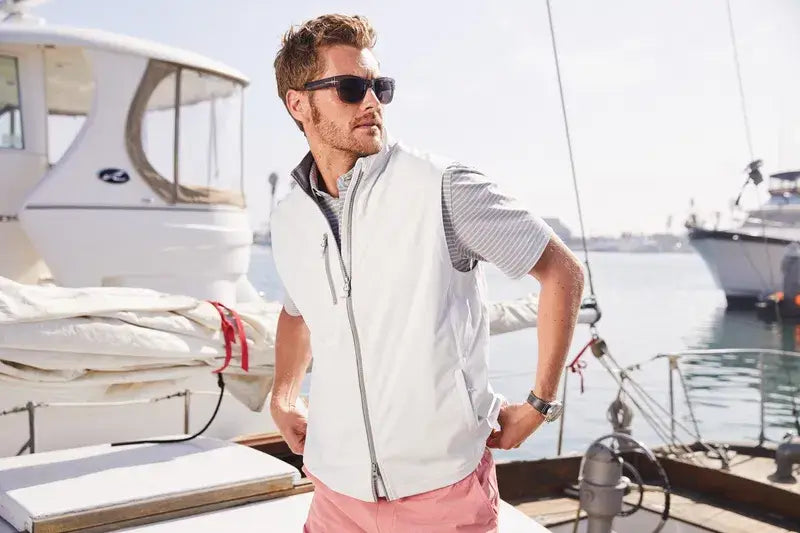 A professional modeling a premium white vest, ideal for high-end corporate retreats